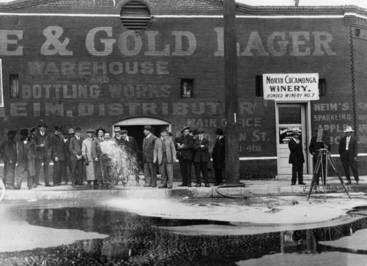 On Jan. 19, 1920, 33,100 gallons of wine were flushed into the gutter outside the North Cucamonga Winery in Los Angeles (845 N. Alameda) at the start of the National Prohibition on intoxicating drink.  (Photo by Topical Press Agency/Getty Images)