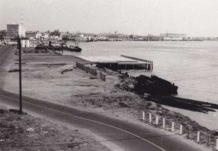 Land has been cleared, center, for the construction of the Ports O' Call Restaurant, the first structure at Ports O' Call. Undated photo ca. 1960, with the Vincent Thomas Bridge under construction in the distance. (Photo courtesy San Pedro Bay Historical Society)