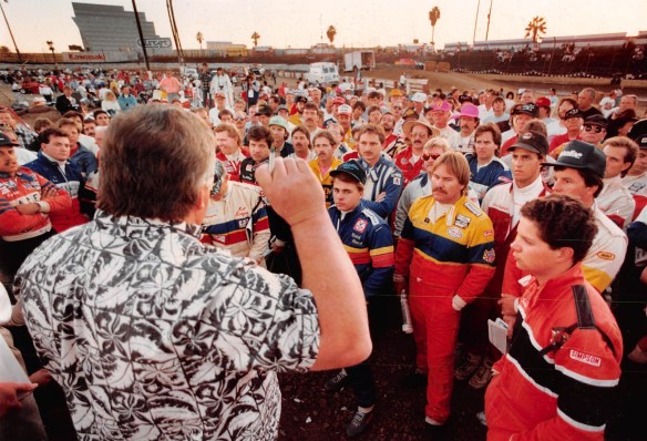 USAC official gives instructions to a large crowd of midget car drivers before racing begins on Ascot's final night, Nov. 22, 1990. (Daily Breeze staff file photo)