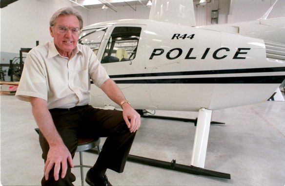 Frank Robinson of Robinson Helicopter Company, Torrance. Behind him is the R44 helicopter, police version. (1998 Daily Breeze file photo)