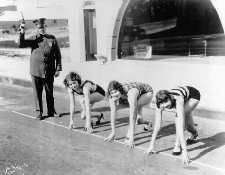 Torrance Chief of Police John Stroh prepares to start a race featuring three bathing beauties wearing heels in this undated publicity shot taken for the Torrance Factory Frolic, most probably in 1938. (File photo)