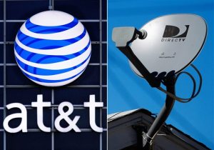 This combo made from file photos shows the AT&T logo on the side of a corporate office in Springfield, Ill., left, and a DirecTV satellite dish atop a home in Los Angeles. (AP Photo)
