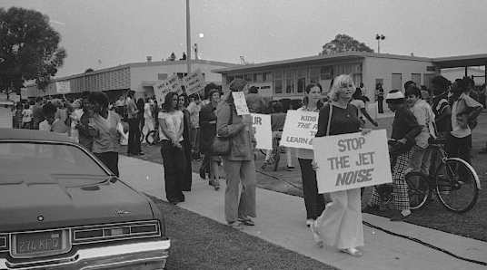 Protesters from the group "The Enraged Citizens" at Felton Elementary School in Lennox carry picket signs decrying the arrival of the Concorde 2 at LAX, about a mile away, on Oct. 23, 1974. Daily Breeze file photo.