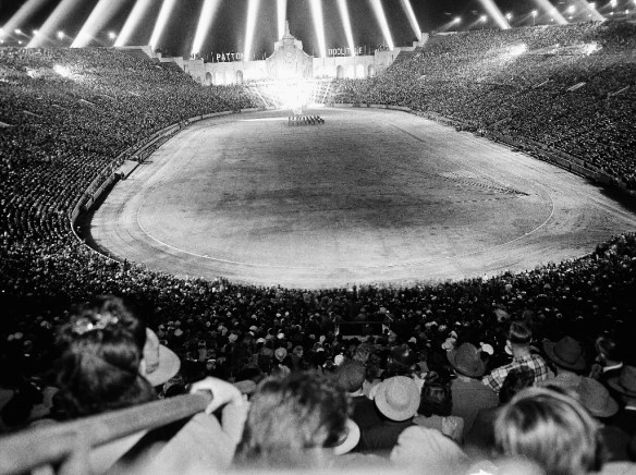 Grateful Americans, more than 100,000 of them, pack Los Angeles Memorial Coliseum to the rim, June 9, 1945, to pay homage to Gen. George S. Patton Jr. and Lt. Gen. James H. Doolittle. The Coliseum pageant climaxed a day of welcome to the conquering generals and 47 accompanying soldiers and fliers. (AP Photo/Dick Strobel)