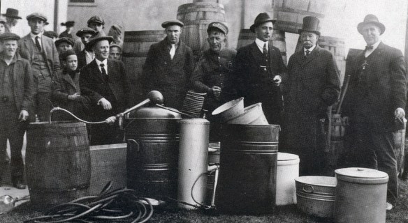 Undated photograph shows Redondo Beach police officers posing with an illegal still they uncovered during the 1920s. (Redondo Beach Police Department photo)