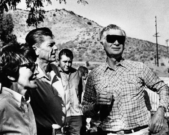 Ronald Reagan and his wife Nancy talk with actor Buddy Ebsen (right) at the Reagan's 305-acre ranch in the Malibu Hills near Los Angeles on Oct. 16, 1966, just before the start of a state-wide political telecast in California during Reagan's campaign for governor of the state. (AP Photo/Harold Filan)