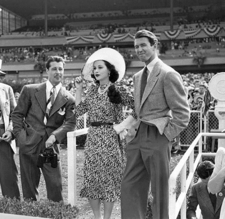 Don Ameche, Carole Lombard and Jimmy Stewart take in the opening day at Hollywood Park racetrack in 1940. (Photo courtesy Carole & Co. website)
