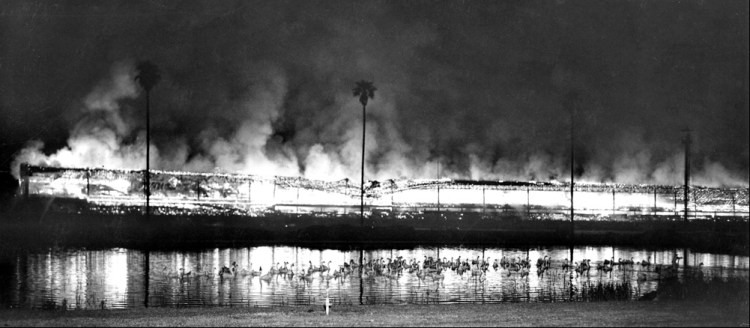 Fire burns down the grandstand at Hollywood Park in 1949. (Associated Press photo)