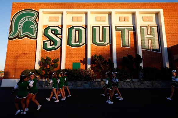 South Torrance cheerleaders walk to the field before the game against West Torrance in a nonleague football game at South High School on Friday, September 27, 2013 in Torrance, Calif. (Michael Yanow / For the Daily Breeze)