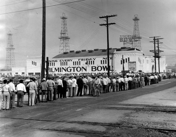 Longshore workers file into the Wilmington Bowl for a Union meeting and report on negotiations during a strike on Sept. 2, 1948. (Photo credit: Los Angeles Public Library)