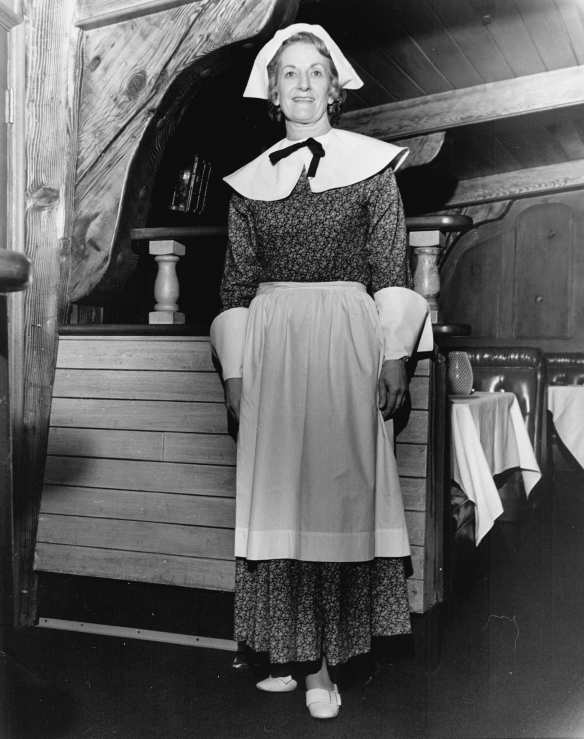 Virginia Haack (was Smith) dressed in traditional American pilgrim outfit (aprons, collars, hats, etc.) that she sewed by hand for all the hostesses at the Indian Village restaurant in California. The waitresses were all in American Indian dress a