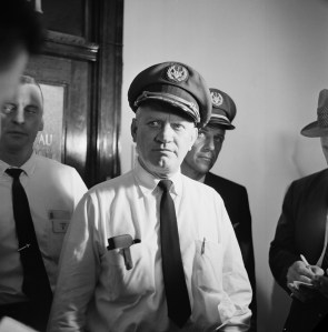 Captain Byron D. Rickards, 52, of the hijacked Continental Airlines jetliner, talks with newsmen outside the El Paso office of the FBI on August 3, 1961. He gave FBI agents a detailed account of the plane seizure. (AP Photo/Ferd Kaufman)