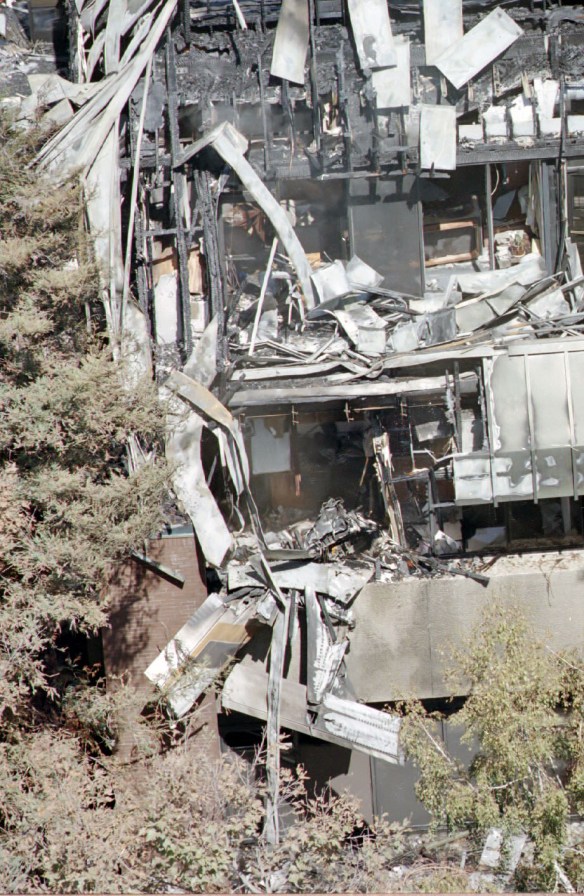 Impact site of the Cessna plane that crashed into a Torrance medical building on Sept. 21, 1997, killing all 4 aboard. Remains of the plane can be seen at bottom. (Daily Breeze staff file photo)