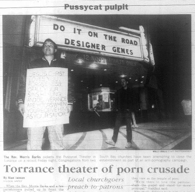 The Rev. Morris Barks holds a religious sign outside the Pussycat Theater in Torrance in early 1991. Daily Breeze photo by Wally Skalij.