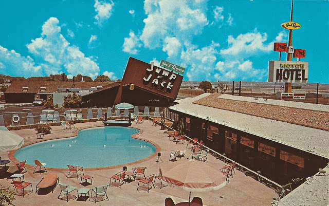 Undated postcard shows the Jump 'N Jack motel, foreground, and restaurant, at rear with angled sign.