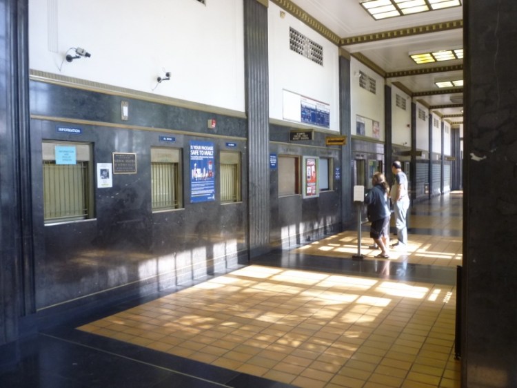 The post office interior. National Register of Historic Places plaqe can be seen on wall between two windows at left.  (May 2015 Daily Breeze file photo)