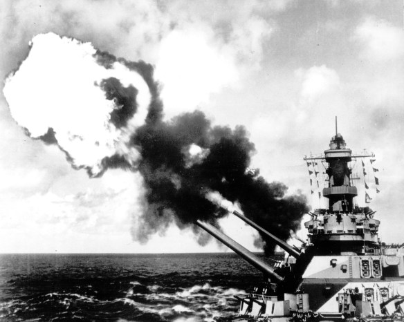 Under way in the South Pacific in 1944, the 16-inch guns of the USS Iowa fire during a battle drill. (AP Photo)