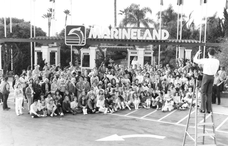 Marineland employees pose in front of the park for a group photo on Feb. 3, 1987. The park would be closed permanently eight days later. Daily Breeze staff photo by Jack Lardomita.