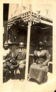 Mrs. Willa Bruce, right, and son Harvey Bruce with his wife Meda. Undated 1920s file photo.