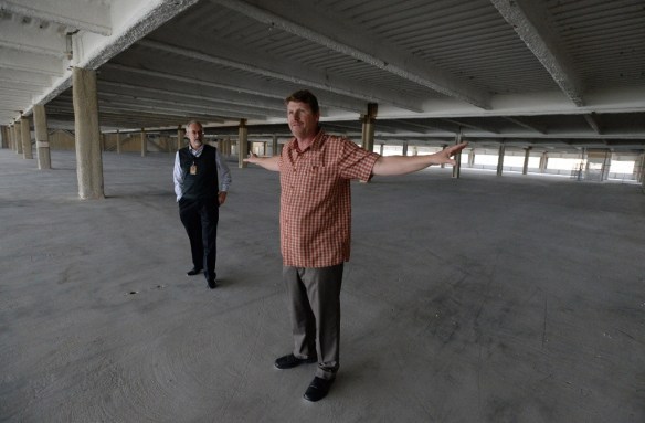 Wiseburn Unified School District Superintendent Dr. Tom Johnstone, left, and Director of Facilities Planning Vince Madsen, right, show a former Northrop Grumman building that will be repurposed into the new Wiseburn High School in this March 2014 Daily Breeze file photo. (Steve McCrank/Staff Photographer)
