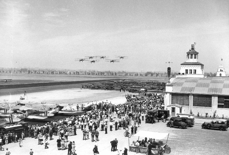 Spectators at the June 7, 1930 dedication of Los Angeles Municipal Airport watch a group of airplanes fly over during the ceremonies. (Photo credit: Los Angeles World Airports)