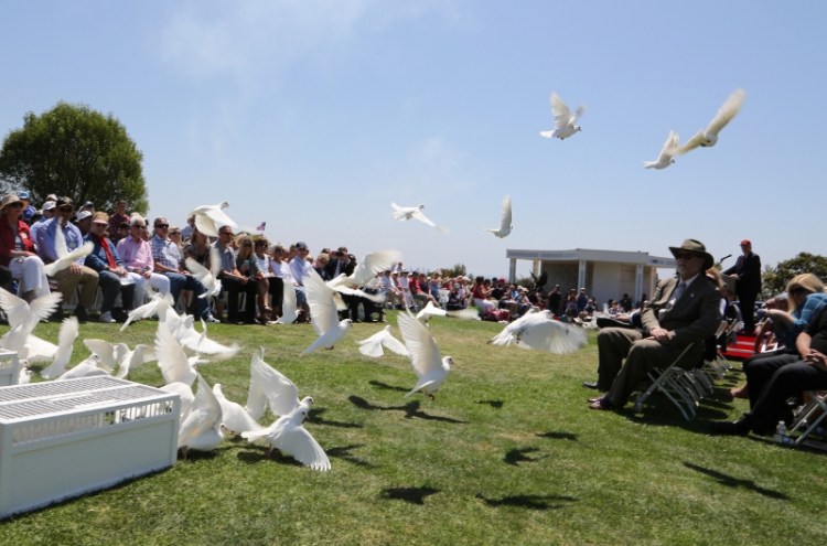 A white dove release during the 29th annual Memorial Day Observance at Green Hills Memorial Park in Rancho Palos Verdes took place Monday May 26th, 2014. (Chuck Bennett / Staff Photographer)