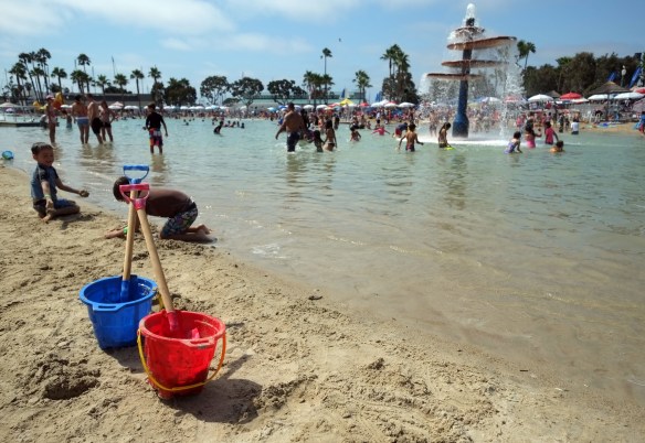 People celebrate the Fourth of July in their swimsuits at Redondo Beach's Seaside Lagoon in 2013. (Daily Breeze photo by Steve McCrank, Staff Photographer)