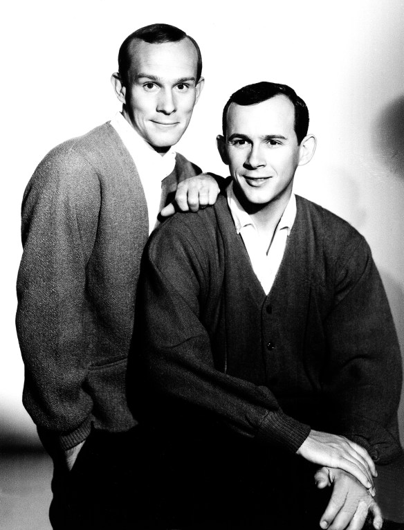 Comedians Tommy, left, and Dick Smothers, during their first continuing television series, "The Smothers Brothers Show," are shown on Aug. 17, 1965. (AP Photo)