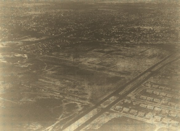 Photo taken from Daily Breeze microfilm of Aug. 21, 1957, special section shows the South Bay Center site before construction, looking northwest with Hawthorne Boulevard running diagonally along bottom right.