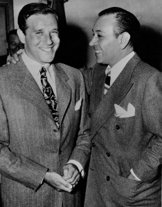 Movie actor George Raft, right, stands with an arm around Benjamin "Bugsy" Siegal at Bugsy's preliminary hearing on charges of bookmaking in Beverly Hills, Ca., July 17, 1944. Raft testified under court subpoena. (AP Photo)