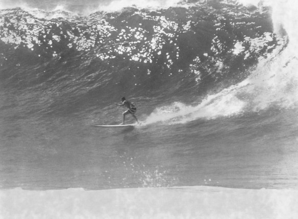 A surfer catches a wave at Hermosa Beach in 1963. (Daily Breeze file photo)