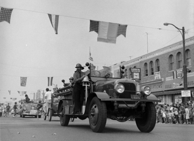 Firemen wearing period outfits ride on a vintage firetruck during the parade for the 1962 Hermosa Beach "1912 Days" event. Daily Breeze file photo.