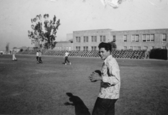 16-year -old Richard Mora throws a ball on the athletic field at Narbonne Junior and Senior High School in 1951, which is now Fleming middle school. (Mora family photo)
