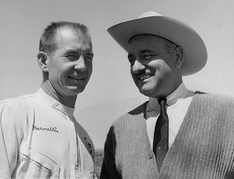 Parnelli Jones, 1963 Indianapolis 500 Champion, and J. C. Agajanian, car-owner, prior to time trials for 1964 Classic at Indianapolis Speedway in May 1964. (AP Photo)