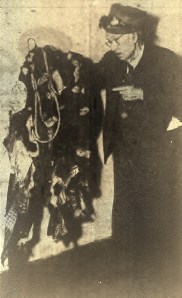 Old George Hewitt points at the 20-lb. costume he wore when impersonating a drunk in this September 1950 Daily Breeze staff photo.