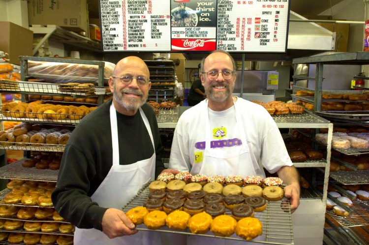 Brothers Larry and Ron Weintraub at Randy's Donuts. Daily Breeze file photo, 2002 (Brad Graverson / Staff Photographer)
