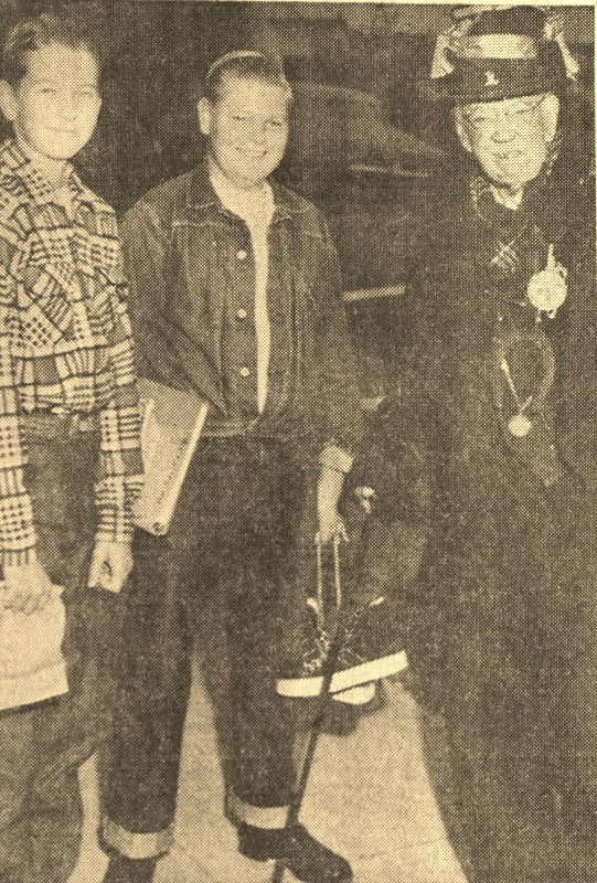 Old George Hewitt, far right, in his drunken character costume, poses in October 1952 with Ralph Rall, 13, and Reggie Shields by the school bus stop in front of his home. Daily Breeze, Nov. 5, 1952.