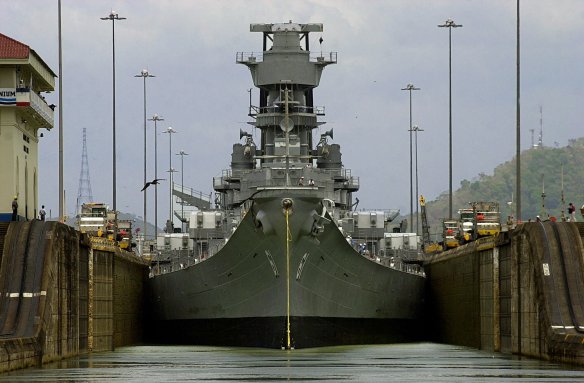The USS Iowa crosses the Panama Canal at Miraflores Lock near Panama City, Panama Wednesday, March 28, 2001. At 108.2 feet wide, the Iowa-class battleships are the largest vessels ever to scrape their way through the 110-foot-wide locks of the canal. They were designed so that they could just fit through the waterway. (AP Photo/Tomas Munita)