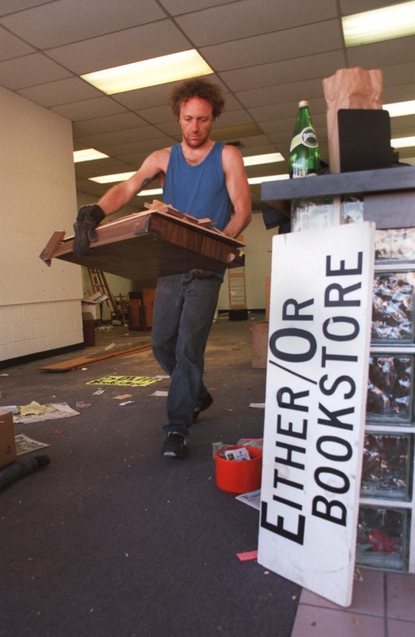 At the Either/Or bookstore in Hermosa Beach, workers clear  out the place after it  went out of business. It was a lower Pier Avenue landmark for about 30 years, until its lease ran out and the rent skyrocketed, prompting it to move to its smaller, current location on Aviation Blvd. Sept. 3, 1999 file photo. (Brad Graverson / Staff Photographer)